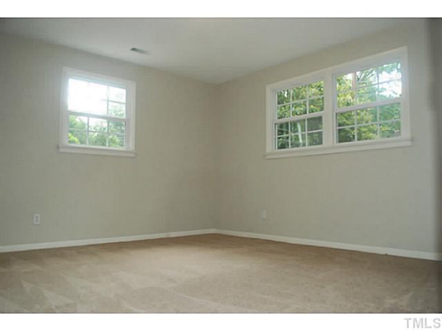 408 Latimer Road Raleigh, NC 27609 - Photo 17 of 24 This bedroom located on the main level offers the privacy of a master suite.