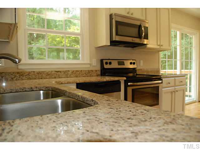 408 Latimer Road Raleigh, NC 27609 - Photo 3 of 24 Granite countertops and stainless appliances.