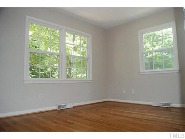 408 Latimer Road Raleigh, NC 27609 - Photo 10 of 24 First bedroom on the first floor is located on the front of the home.