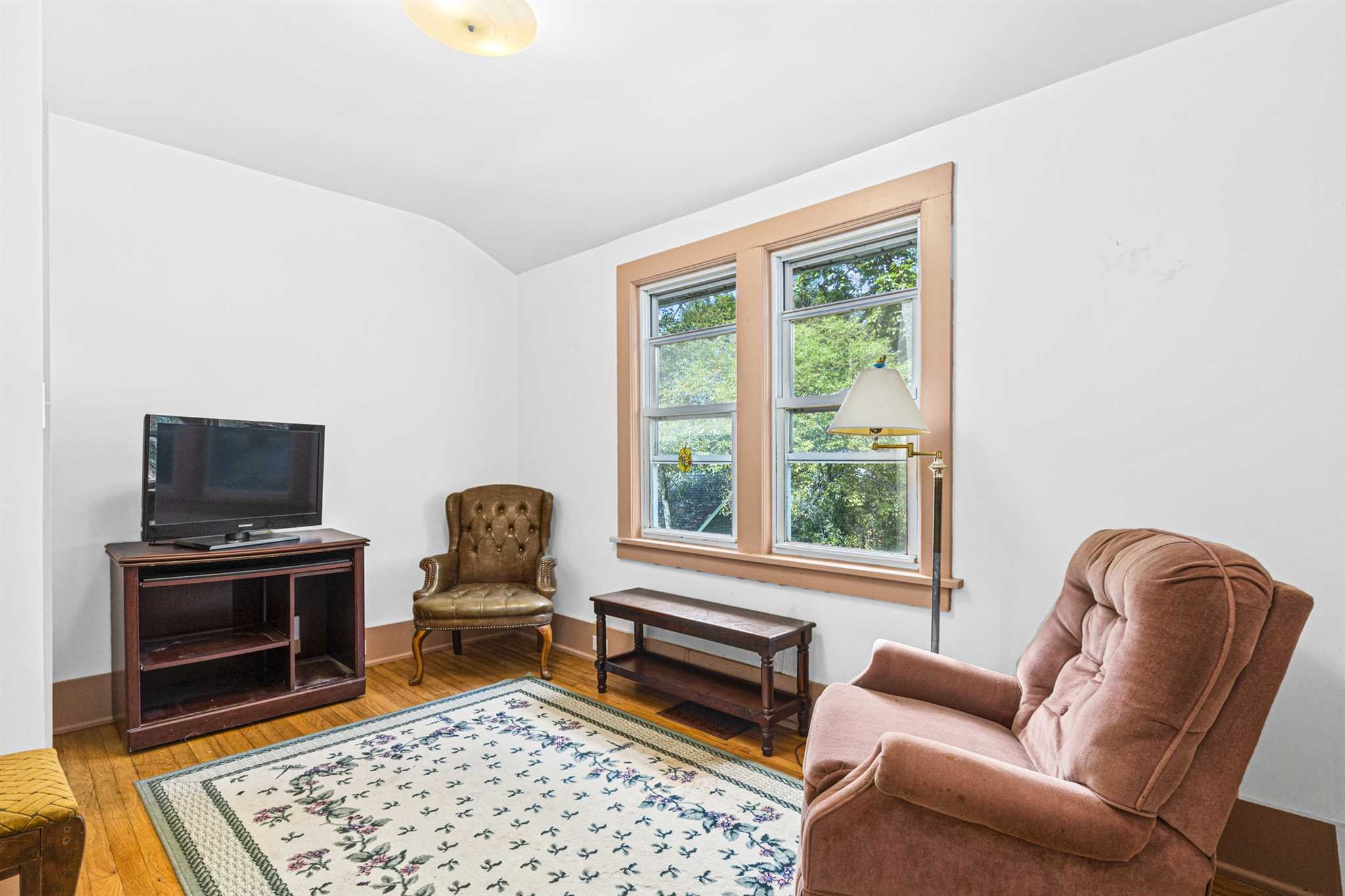 10 Townsend Boulevard Poughkeepsie, NY 12603 - Photo 11 of 15 a living room with furniture a flat screen tv and a fireplace