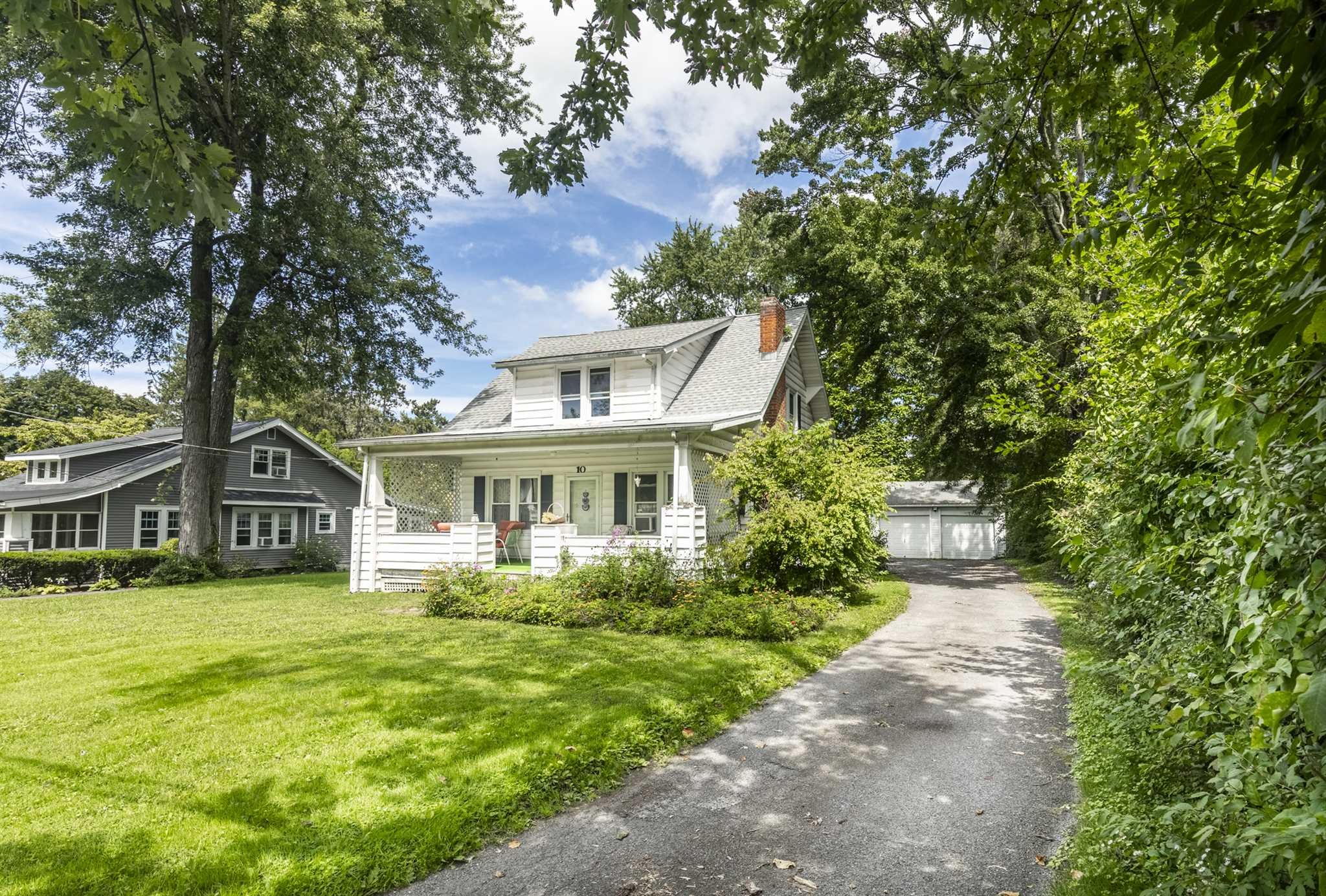 10 Townsend Boulevard Poughkeepsie, NY 12603 - Photo 2 of 15 a front view of a house with a garden