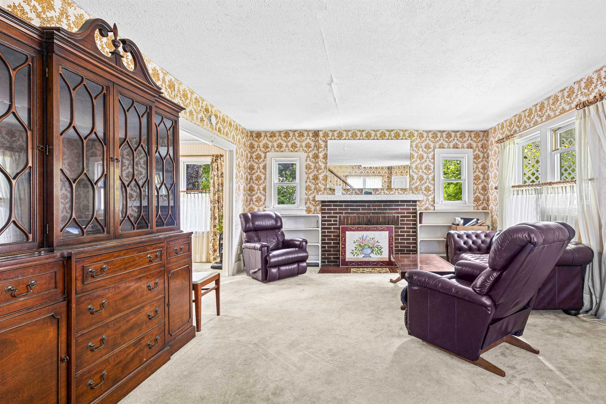 10 Townsend Boulevard Poughkeepsie, NY 12603 - Photo 4 of 15 a living room with furniture and a fireplace