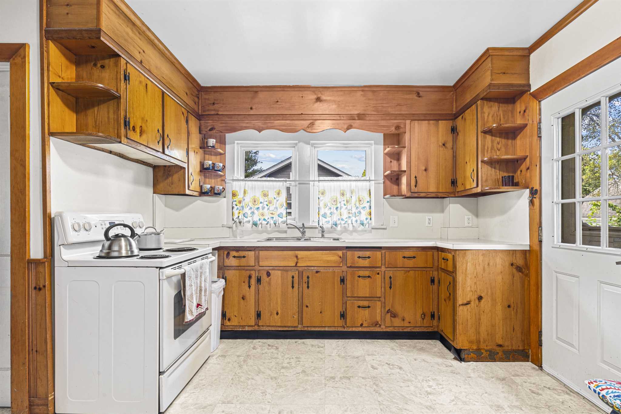 10 Townsend Boulevard Poughkeepsie, NY 12603 - Photo 5 of 15 a kitchen with stainless steel appliances granite countertop a sink and cabinets