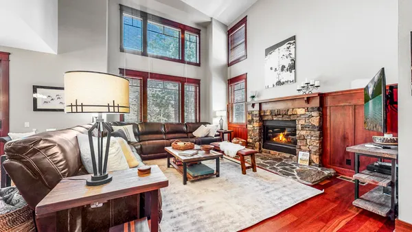 a living room with furniture fireplace and flat screen tv
