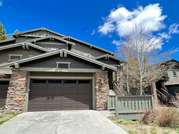a front view of a house with a garage