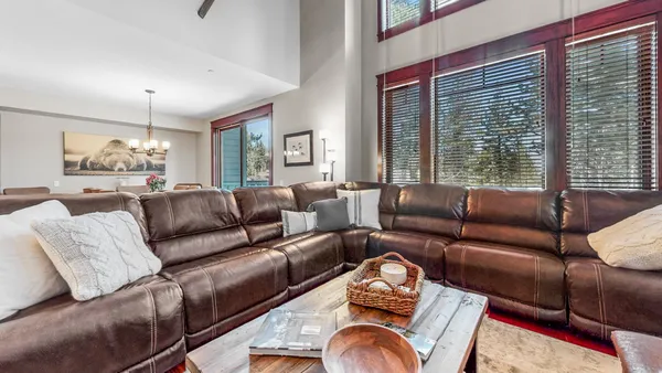 a living room with furniture or couch and a large window