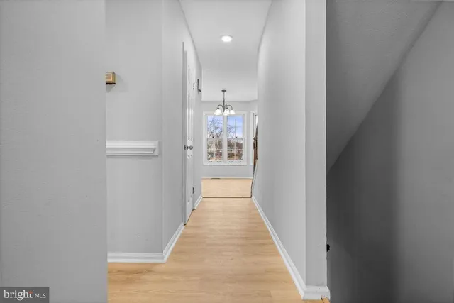 a view of a hallway with white walls