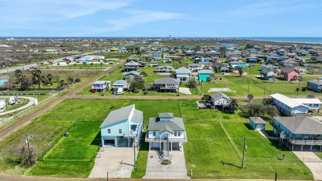 an aerial view of a houses with a outdoor space