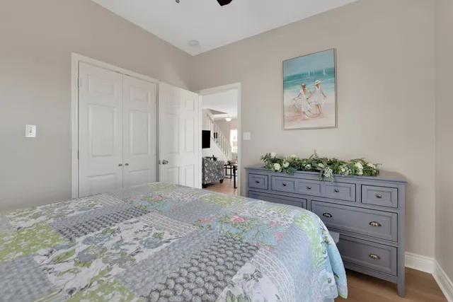 a bedroom with a bed and a dresser