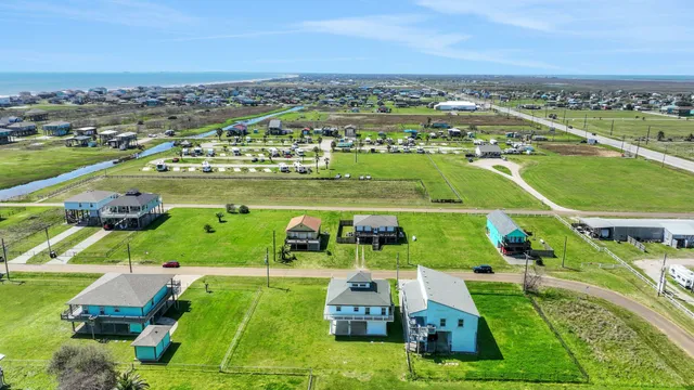 an aerial view of a houses with a outdoor space