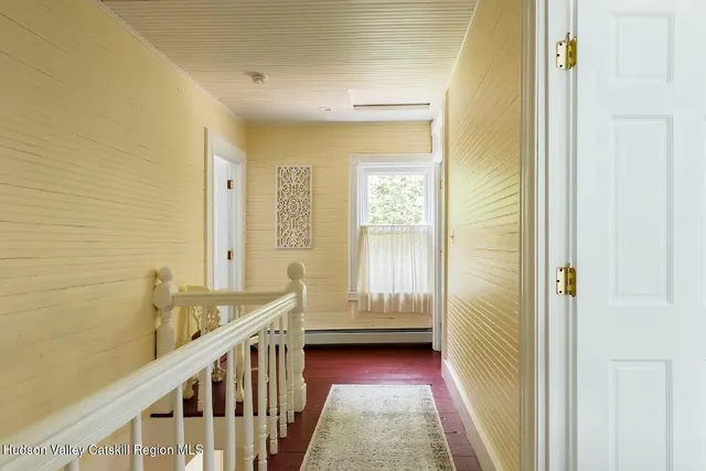 a view of a bathroom with sink and shower