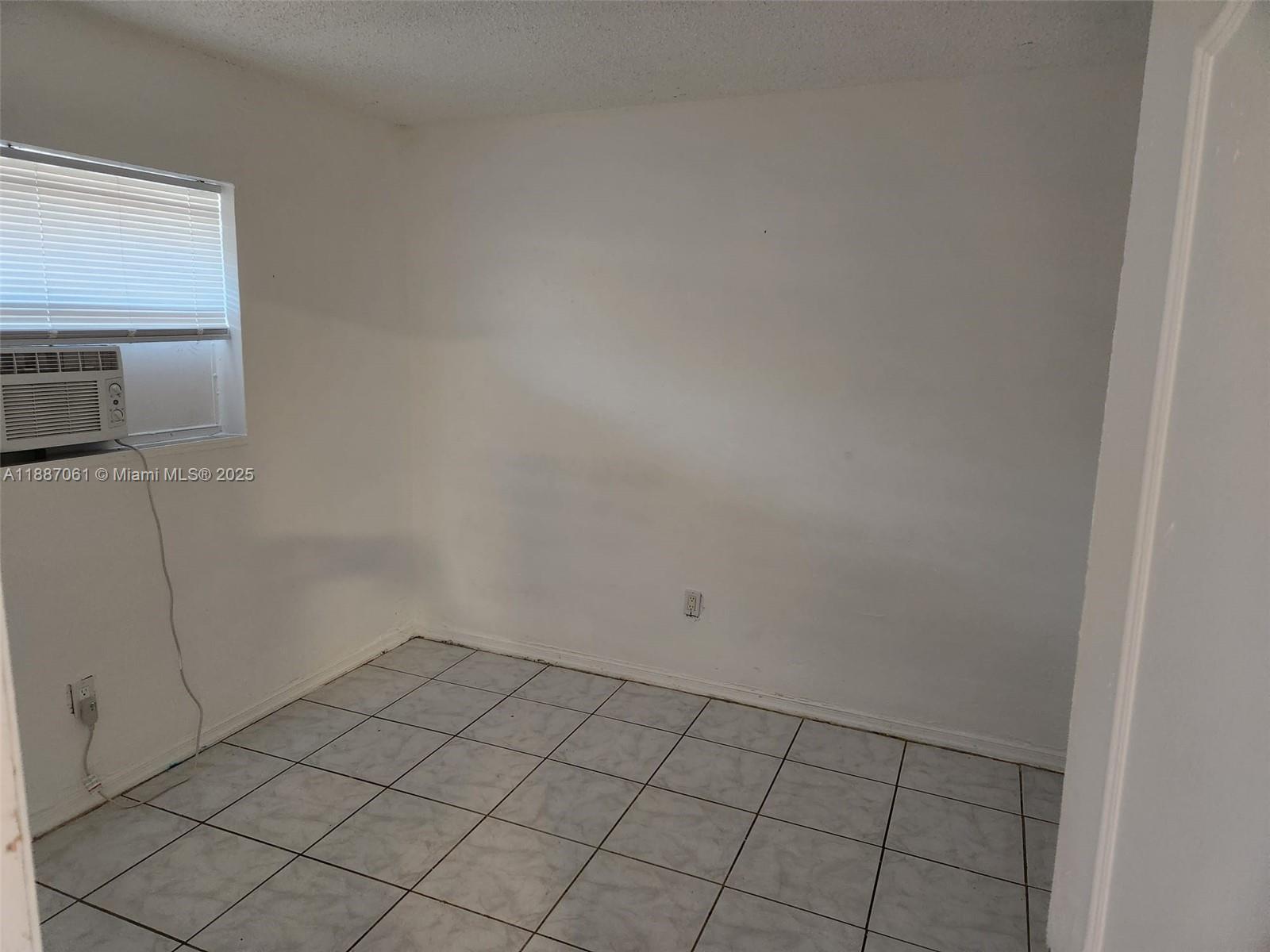 2640 Northwest 2nd Street, Unit 3 Pompano Beach, FL 33069 - Photo 5 of 9 a view of an empty room