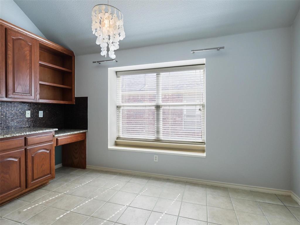 5628 Rock Canyon Road The Colony, TX 75056 - Photo 12 of 24 a view of an empty room with a kitchen