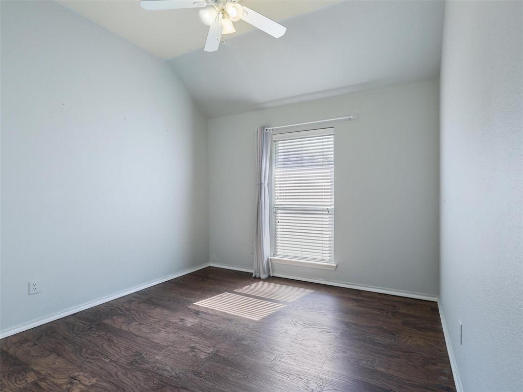 5628 Rock Canyon Road The Colony, TX 75056 - Photo 14 of 24 an empty room with wooden floor and windows