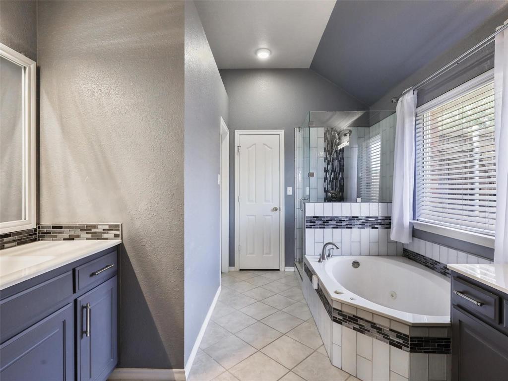5628 Rock Canyon Road The Colony, TX 75056 - Photo 18 of 24 a bathroom with a tub sink and mirror
