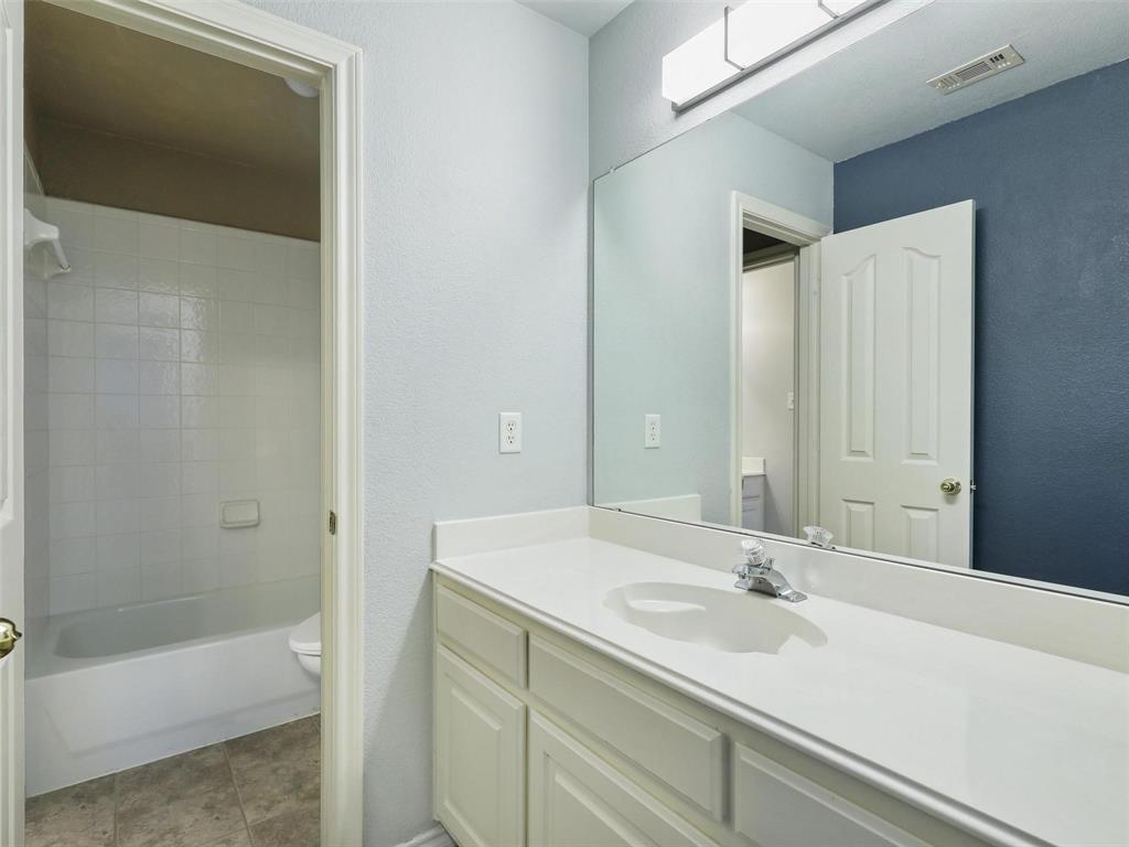 5628 Rock Canyon Road The Colony, TX 75056 - Photo 20 of 24 a bathroom with a sink and a bathtub
