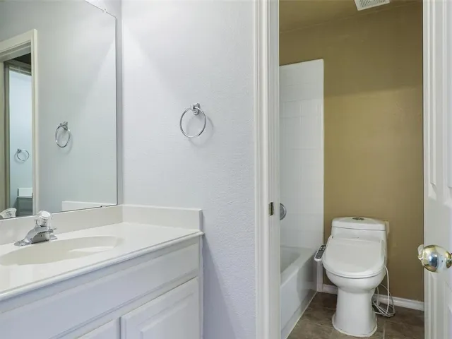 a bathroom with a sink and a toilet