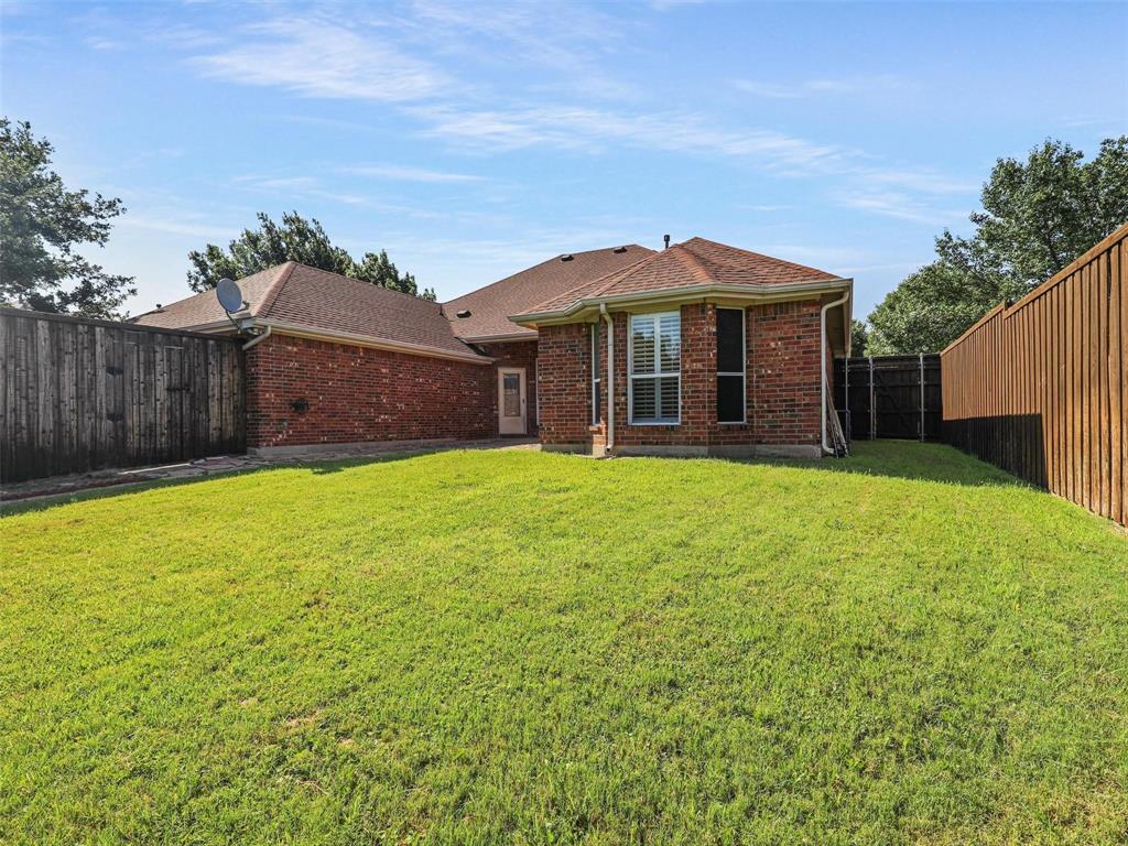 5628 Rock Canyon Road The Colony, TX 75056 - Photo 24 of 24 a view of a house with a yard
