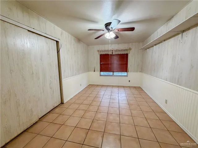 a view of an empty room and a window