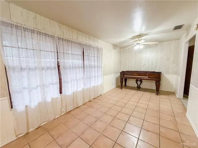 a view of an empty room and a window