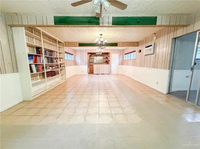 a view of a kitchen with furniture and wooden floor