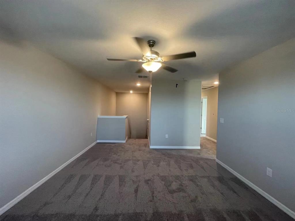 31875 Sun Kettle Loop Wesley Chapel, FL 33545 - Photo 11 of 23 a view of an empty room
