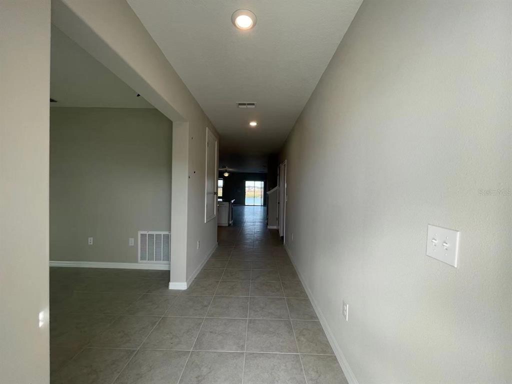 31875 Sun Kettle Loop Wesley Chapel, FL 33545 - Photo 5 of 23 a view of a hallway