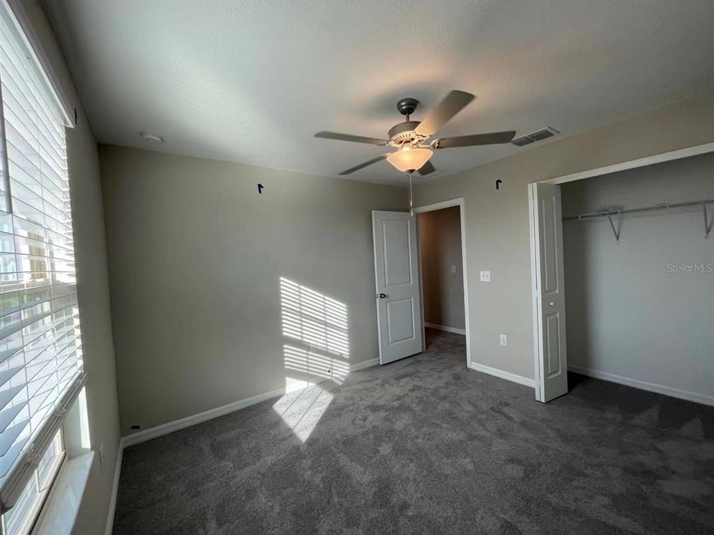 31875 Sun Kettle Loop Wesley Chapel, FL 33545 - Photo 10 of 23 a view of an empty room with a window