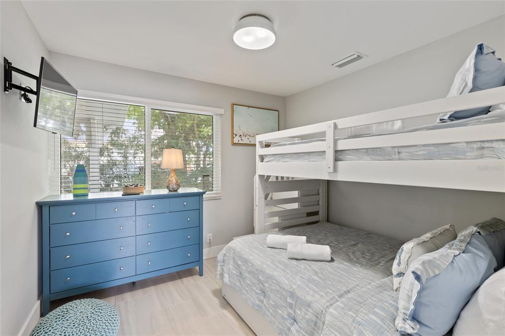 110 Spring Avenue Anna Maria, FL 34216 - Photo 14 of 62 a room with a bed and a window