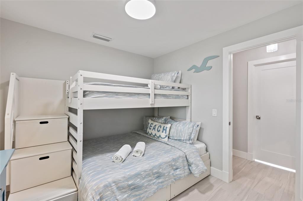 110 Spring Avenue Anna Maria, FL 34216 - Photo 15 of 62 a bedroom with a bed and closet