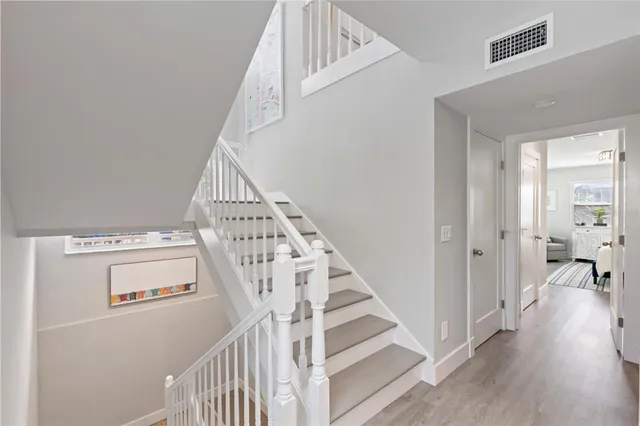 a bedroom with a large bed and a large window
