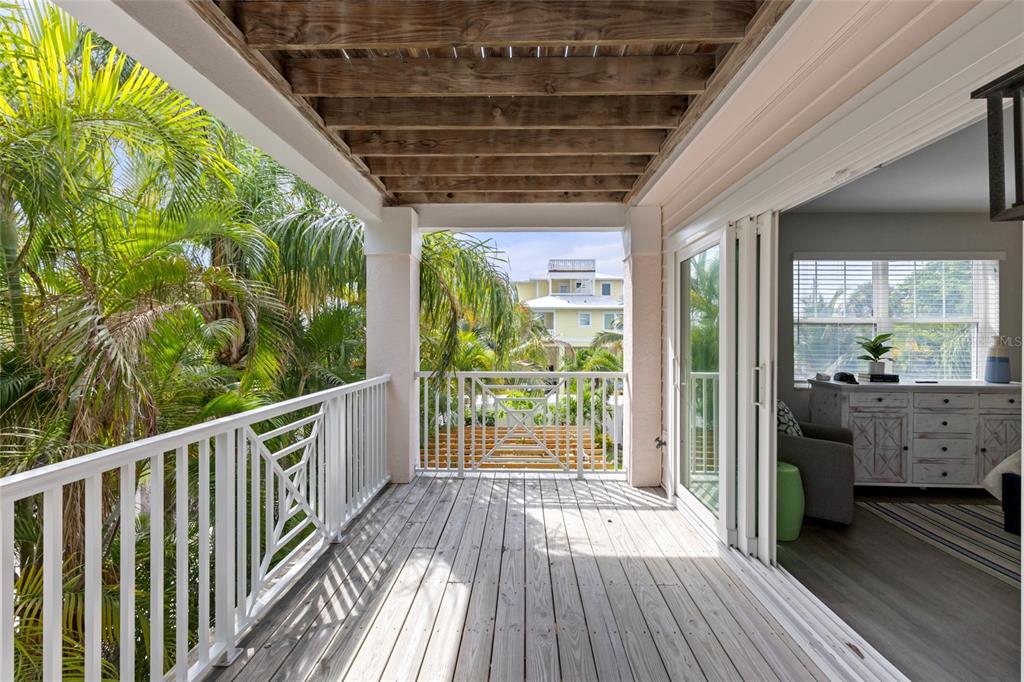 110 Spring Avenue Anna Maria, FL 34216 - Photo 23 of 62 a view of balcony with wooden floor