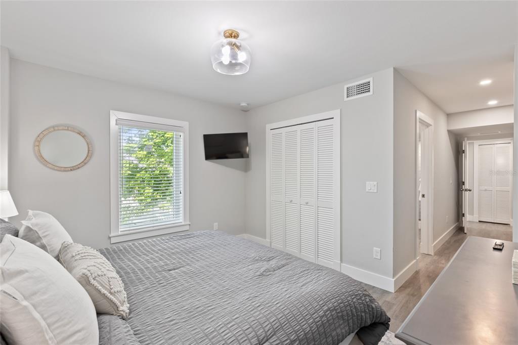 110 Spring Avenue Anna Maria, FL 34216 - Photo 29 of 62 a bedroom with a bed and a window