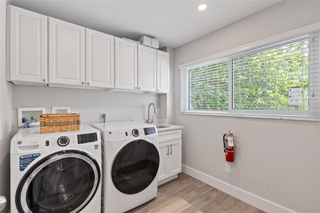 110 Spring Avenue Anna Maria, FL 34216 - Photo 30 of 62 a utility room with dryer and washer