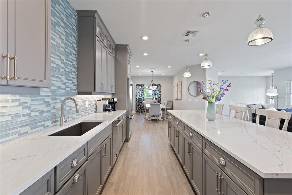 110 Spring Avenue Anna Maria, FL 34216 - Photo 34 of 62 a large kitchen with stainless steel appliances lots of counter space and a sink