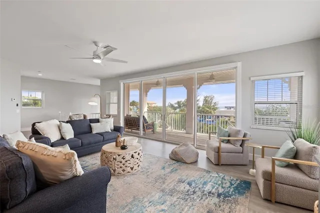 a balcony with furniture and a potted plant