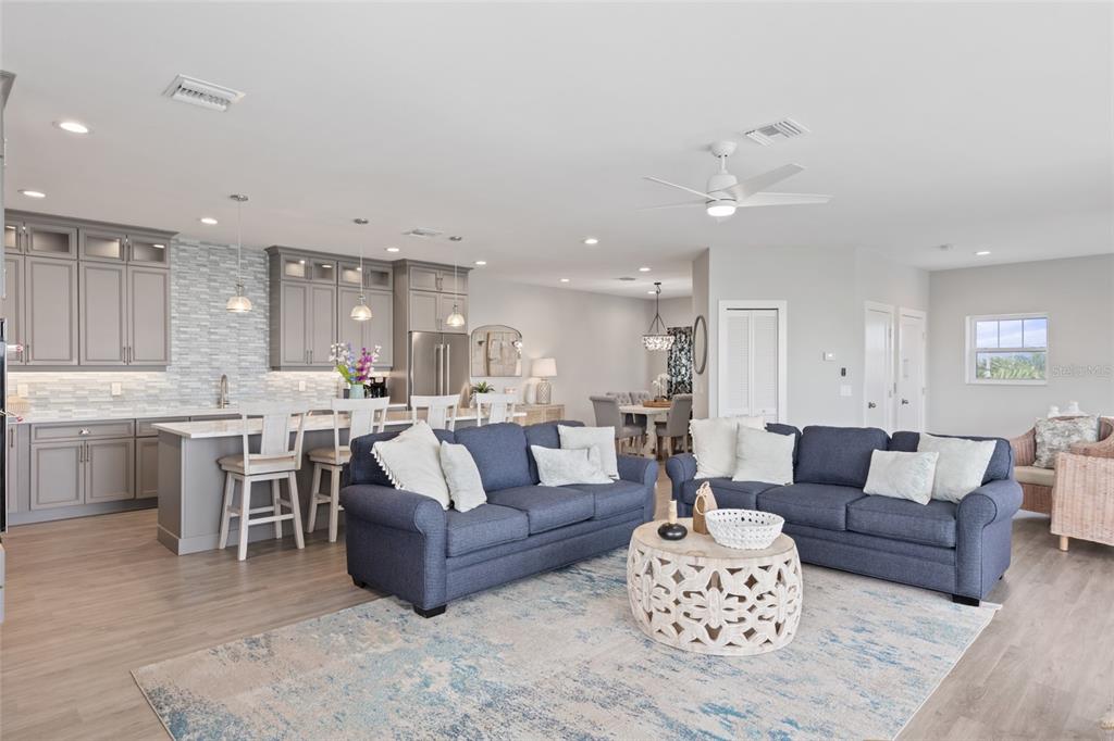 110 Spring Avenue Anna Maria, FL 34216 - Photo 42 of 62 a living room with furniture kitchen and a table