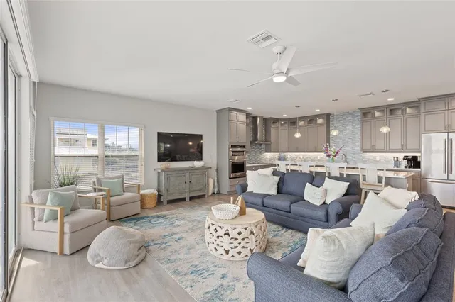 a view of a balcony with chairs and wooden floor