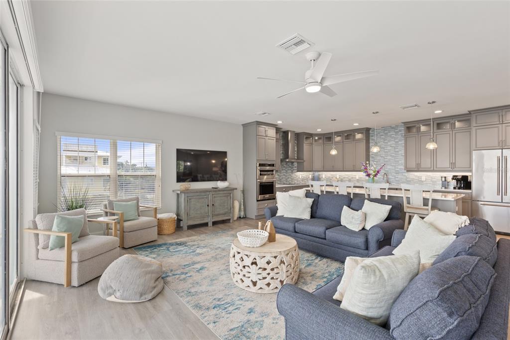 110 Spring Avenue Anna Maria, FL 34216 - Photo 43 of 62 a living room with furniture and a flat screen tv