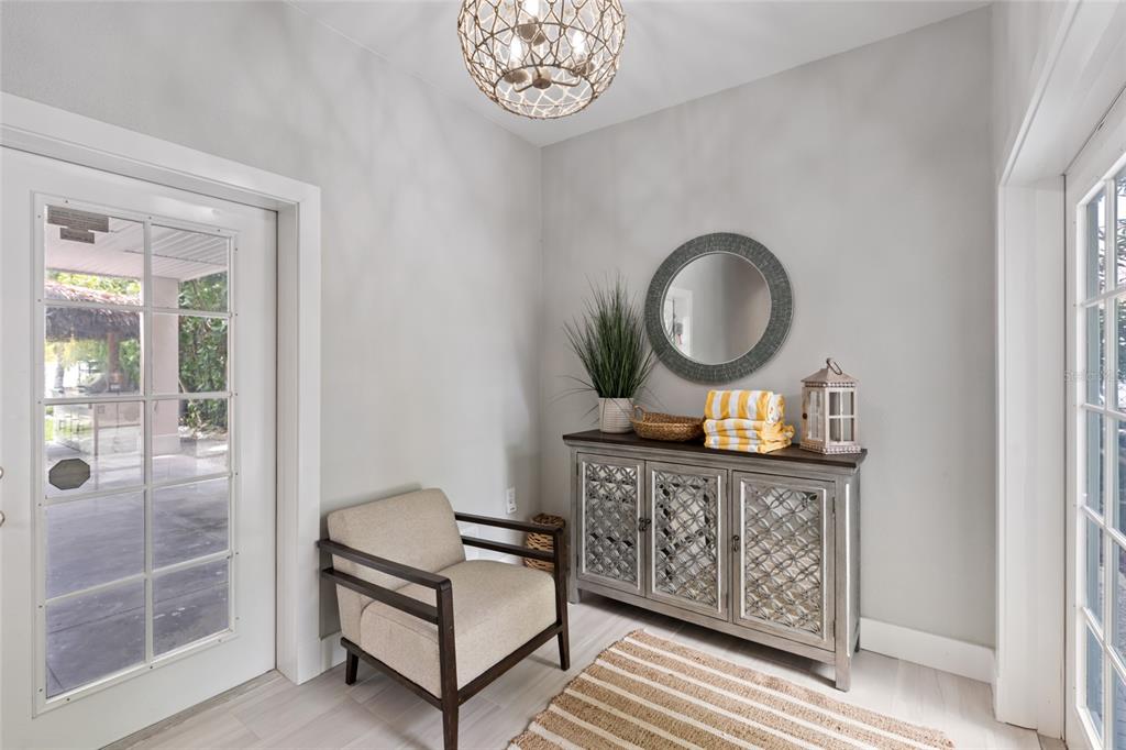 110 Spring Avenue Anna Maria, FL 34216 - Photo 5 of 62 a living room with furniture and a wooden floor