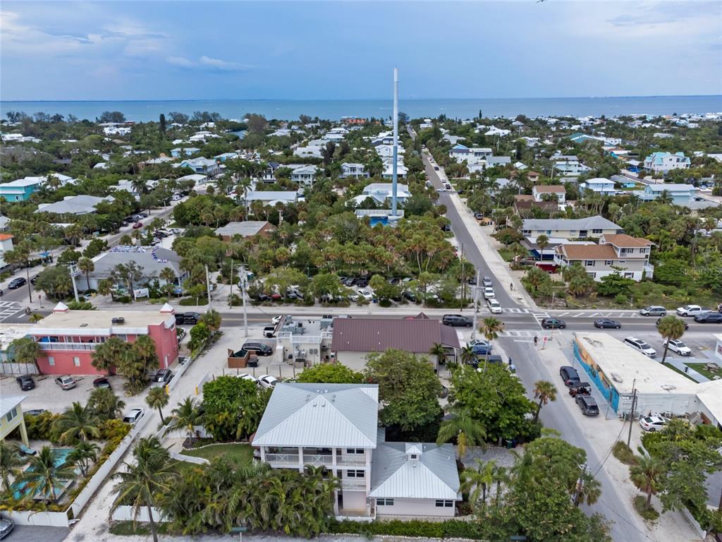 110 Spring Avenue Anna Maria, FL 34216 - Photo 57 of 62 an aerial view of residential houses with outdoor space and ocean view