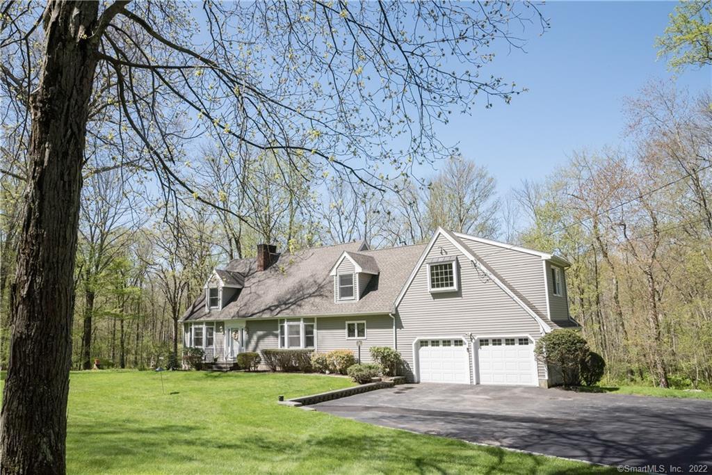 14 John Beach Road Newtown, CT 06470 - Photo 1 of 1 a front view of a house with a yard