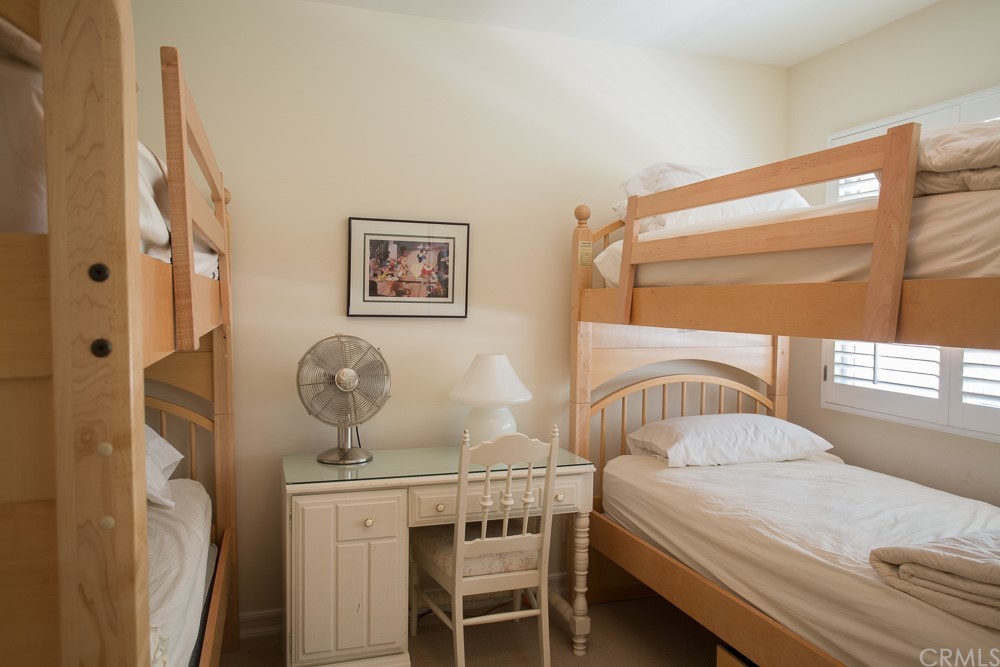 1004 Emerald Bay Laguna Beach, CA 92651 - Photo 12 of 15 a bedroom with a bed and a table