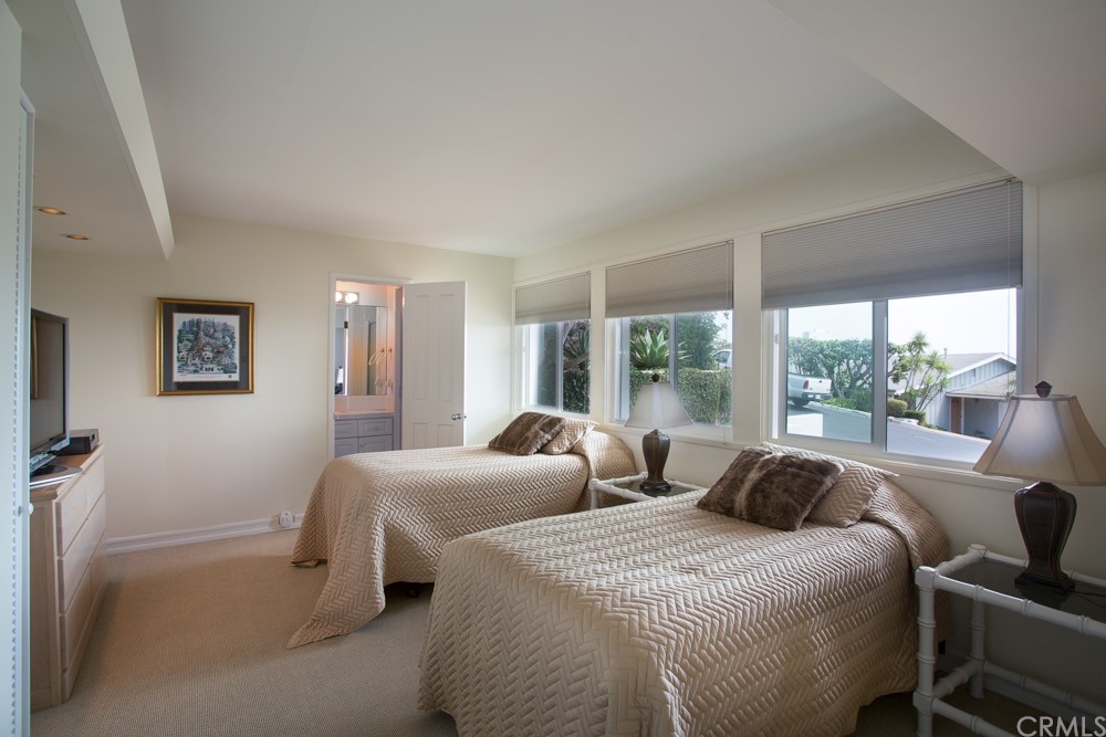 1004 Emerald Bay Laguna Beach, CA 92651 - Photo 13 of 15 a bedroom with two beds and a large window