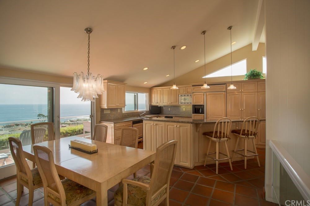 1004 Emerald Bay Laguna Beach, CA 92651 - Photo 3 of 15 a kitchen with kitchen island a large counter top space appliances and cabinets