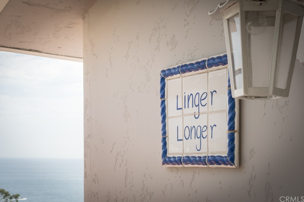 1004 Emerald Bay Laguna Beach, CA 92651 - Photo 6 of 15 a sign on a wall next to a window