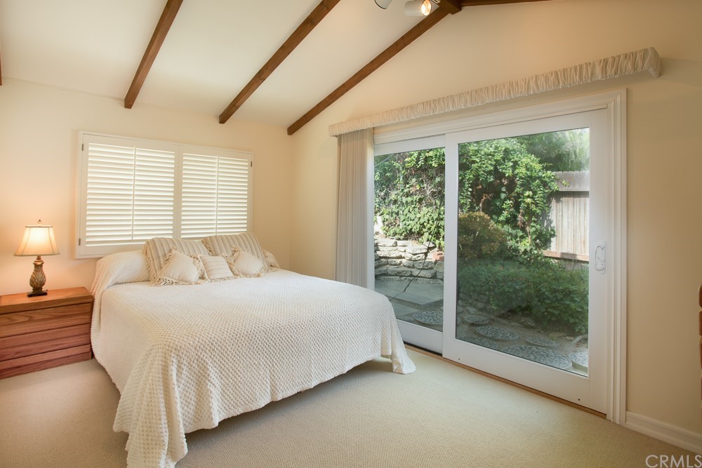1004 Emerald Bay Laguna Beach, CA 92651 - Photo 10 of 15 a bedroom with a bed and a window