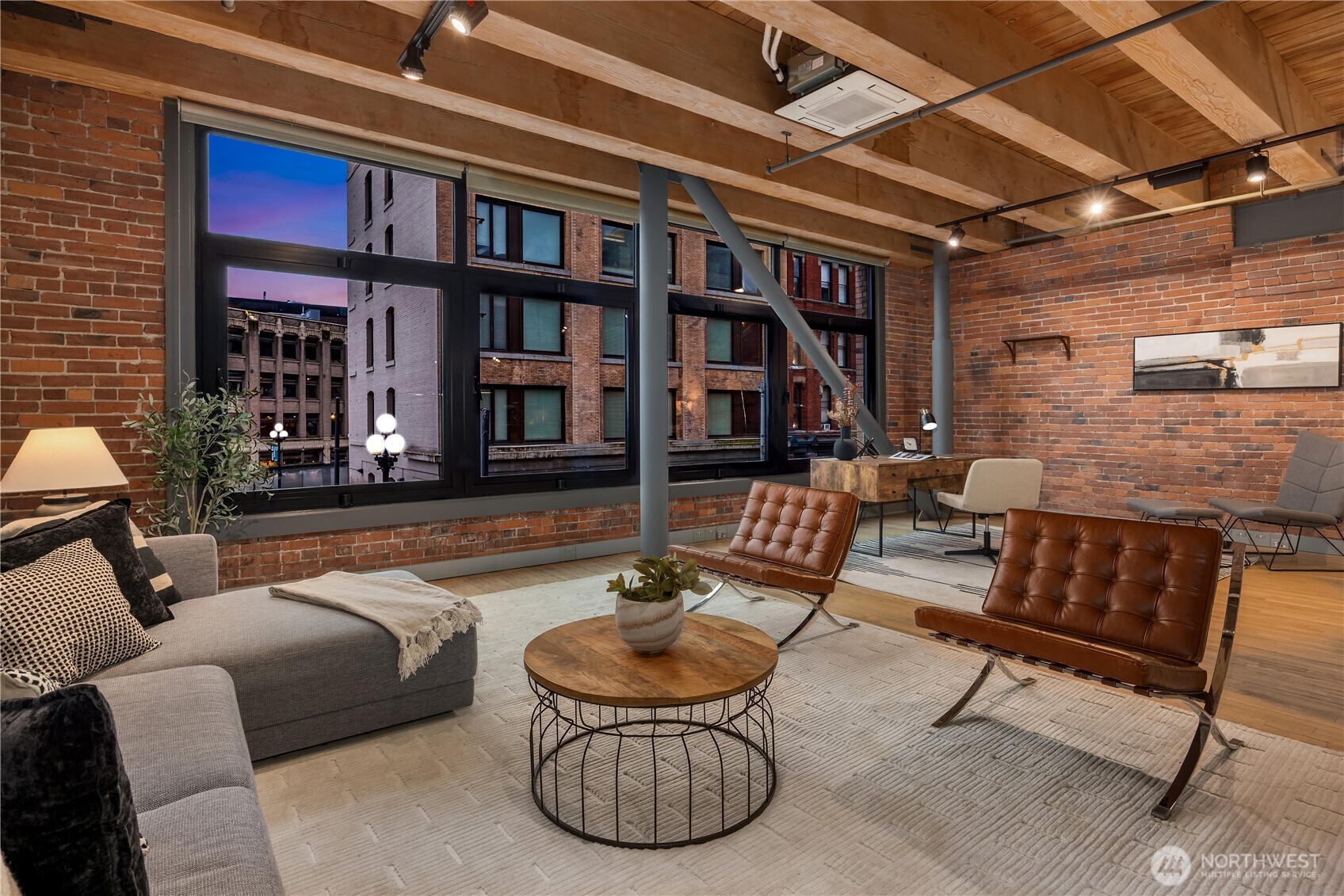 210 3rd Avenue South, Unit 2C Seattle, WA 98104 - Photo 11 of 40 a outdoor living space with furniture and a fireplace