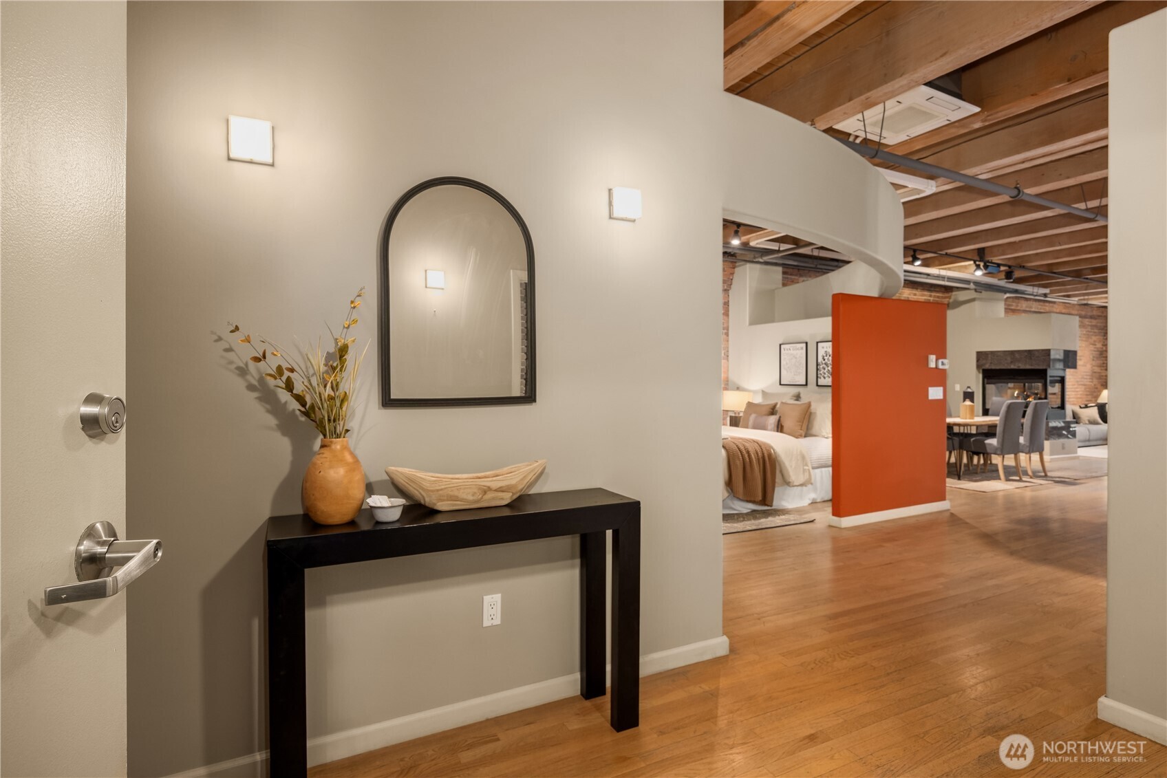 210 3rd Avenue South, Unit 2C Seattle, WA 98104 - Photo 2 of 40 a view of a livingroom with furniture and wooden floor