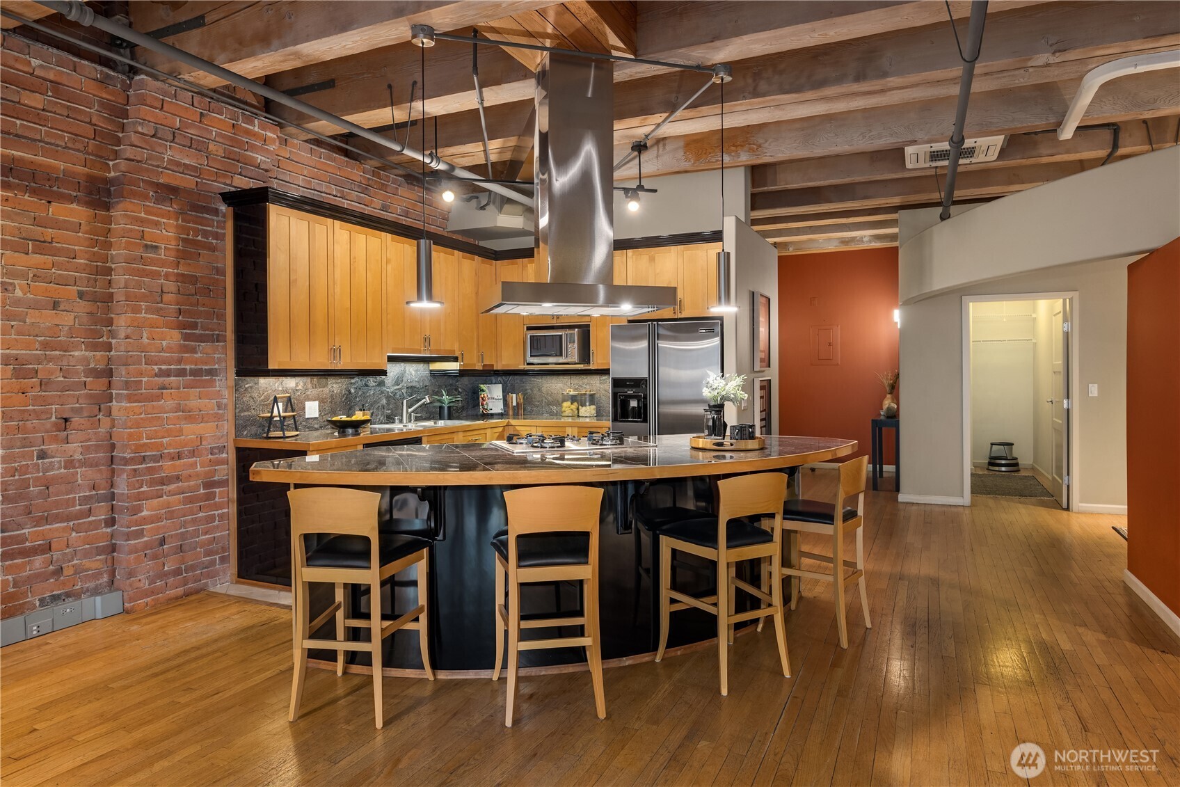 210 3rd Avenue South, Unit 2C Seattle, WA 98104 - Photo 6 of 40 a kitchen with a table and chairs in it